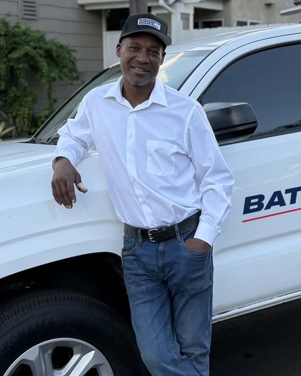 Kenny Battle, owner of Battle Pest Control, next to his truck
