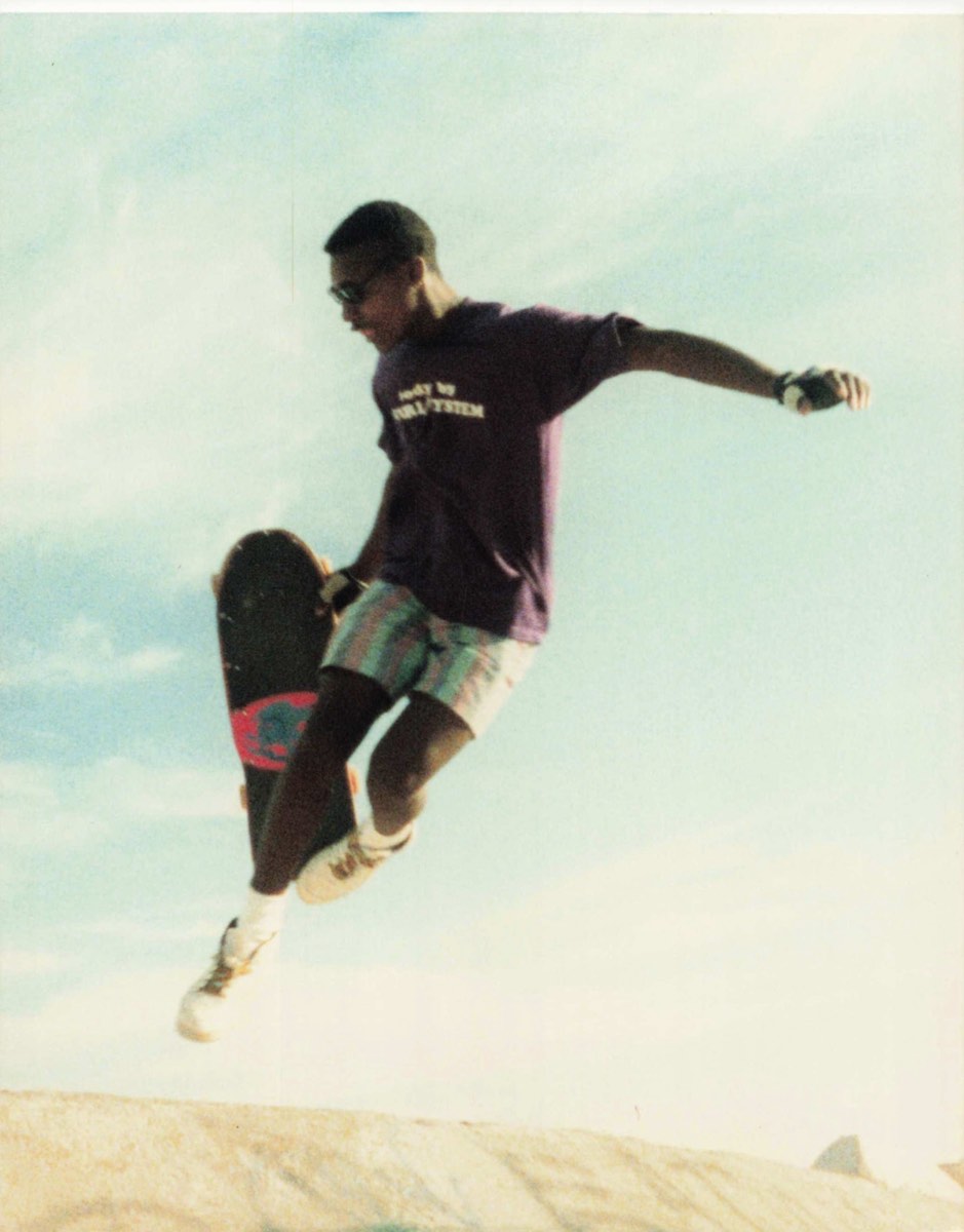Kenny Battle catching air on a skateboard in Poway in the 1980s